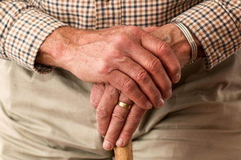 elder man holding cane